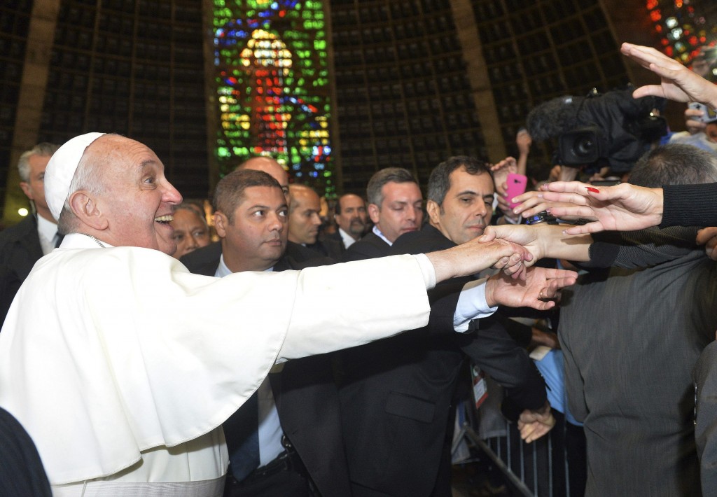 Pope Francis greets pilgrims from Argentina inside Rio cathedral