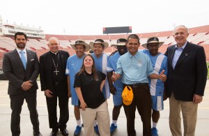 Los Angeles Archbishop Jose H. Gomez, second from left, and Supreme Knight Carl Anderson of the Knights of Columbus, far right, pose July 14 at the Los Angeles Memorial Coliseum with leaders and athletes of the 2015 Special Olympics World Games, scheduled next summer in Los Angeles. The Knights of Columbus has pledged $1.4 million to help cover costs for the games. (CNS photo/Victor Aleman, Vida-Nueva.com) (July 16, 2014) See SPECIAL OLYMPICS (CORRECTED) July 16, 2016.