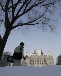 Woman walks past Supreme Court of Canada in Ottawa