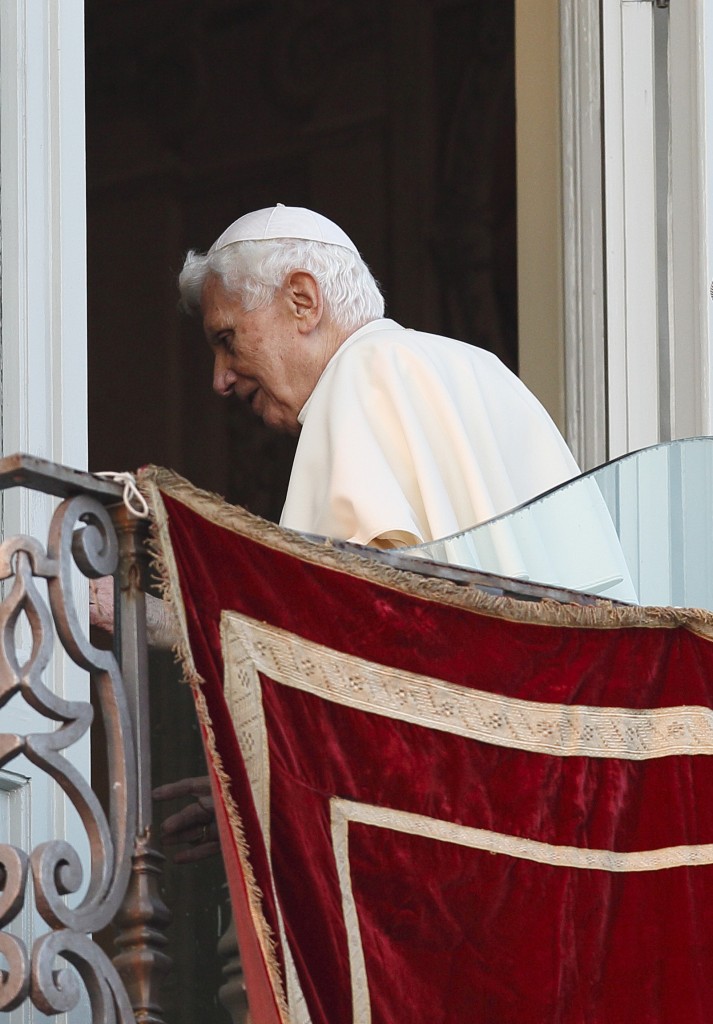 Pope Benedict XVI walks away after making final public appearance as pope in Castel Gandolfo