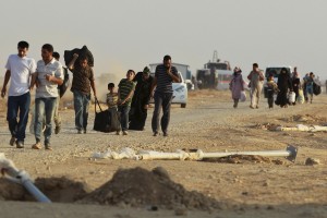 SYRIAN REFUGEES FLEEING VIOLENCE WALK ALONG BORDER IN JORDAN