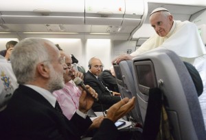 Pope listens to questions from journalists aboard flight back to Rome
