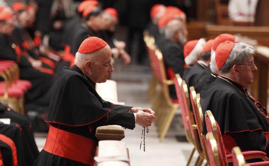 Cardinal George prays rosary before prayer service with eucharistic adoration in St. Peter's Basilica